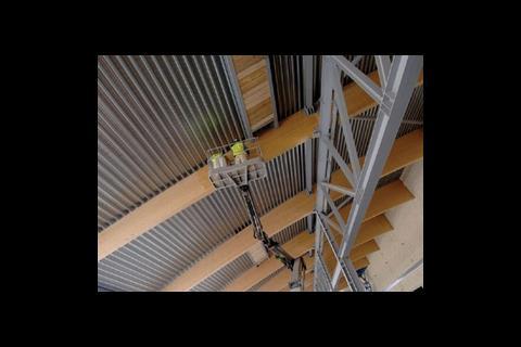 The column-free storage space has been created by supporting the roof on Glulam beams - the longest installed in the UK 